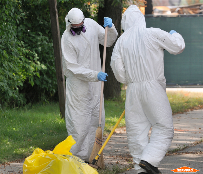 SERVPRO of Northwest Orlando cleaning hazardous waste in biohazard suits near me
